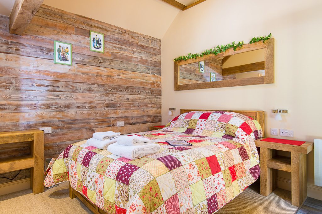 Patchwork quilt in one of the barn bedrooms