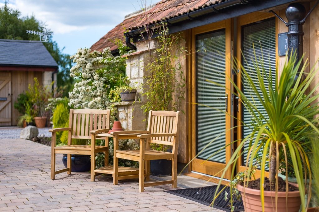 Guest room doors opening onto the planted courtyard